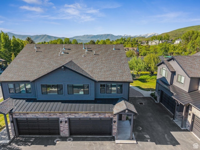 1127 N 520 W Unit 40, Midway, UT 84049 - view of front of house featuring a standing seam roof, an attached garage, a mountain view, and metal roof