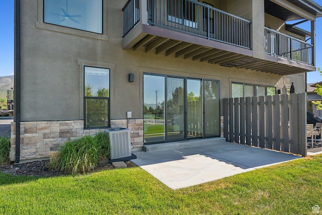 1127 N 520 W Unit 40, Midway, UT 84049 - rear view of house with a balcony, a patio, stucco siding, and stone siding