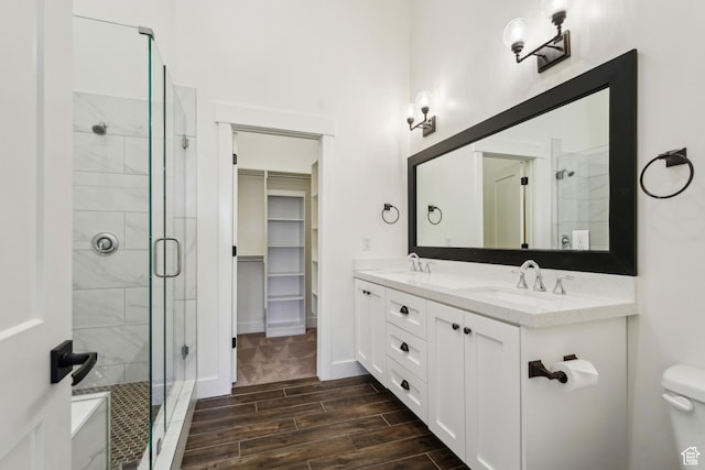 1127 N 520 W Unit 40, Midway, UT 84049 - full bath with a stall shower, double vanity, wood finish floors, toilet, and a spacious closet