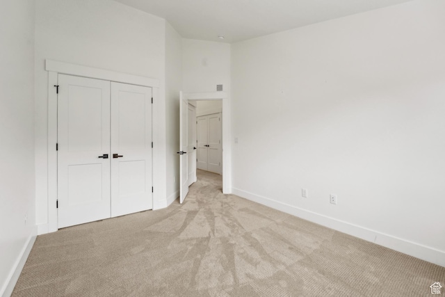 1127 N 520 W Unit 40, Midway, UT 84049 - unfurnished bedroom with light carpet, baseboards, and a closet