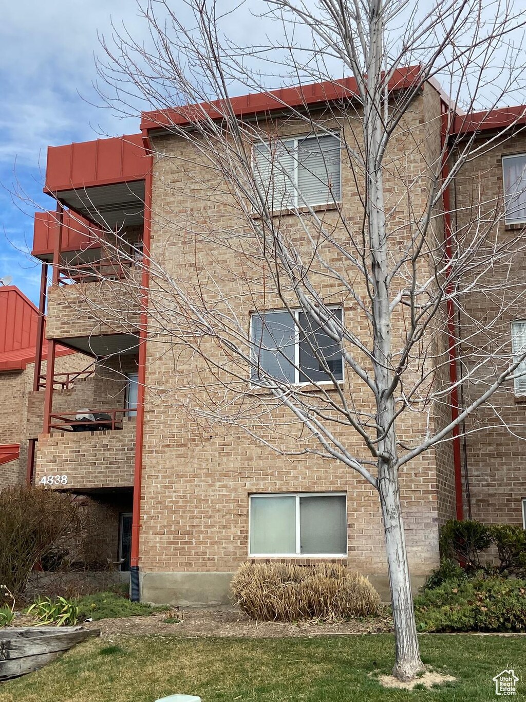 view of property exterior with brick siding