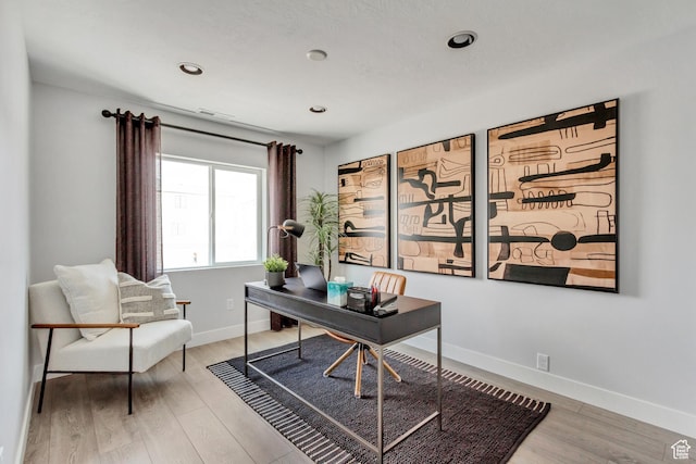office space featuring visible vents, recessed lighting, baseboards, and wood finished floors