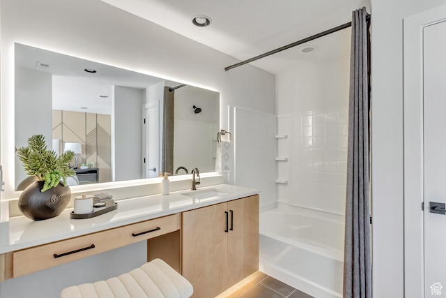 bathroom with visible vents, bathtub / shower combination, vanity, and tile patterned flooring