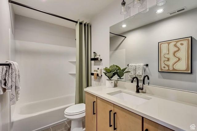 bathroom with vanity, visible vents, shower / bath combo, tile patterned floors, and toilet