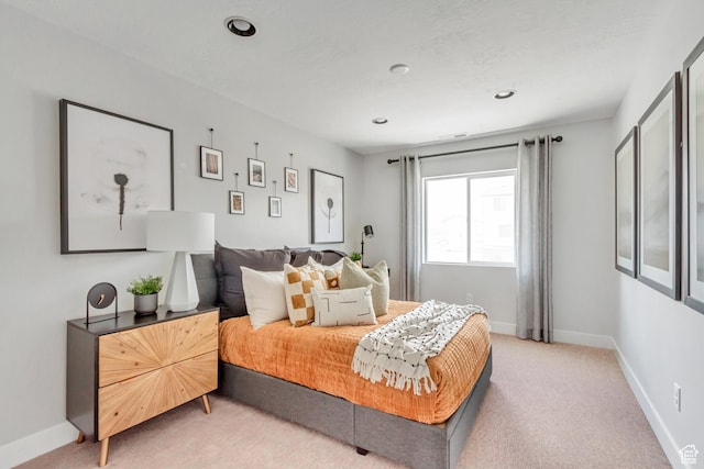 bedroom with recessed lighting, baseboards, and light colored carpet