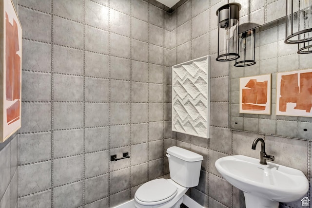 half bath with a sink and toilet