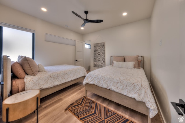 bedroom featuring recessed lighting, ceiling fan, and wood finished floors