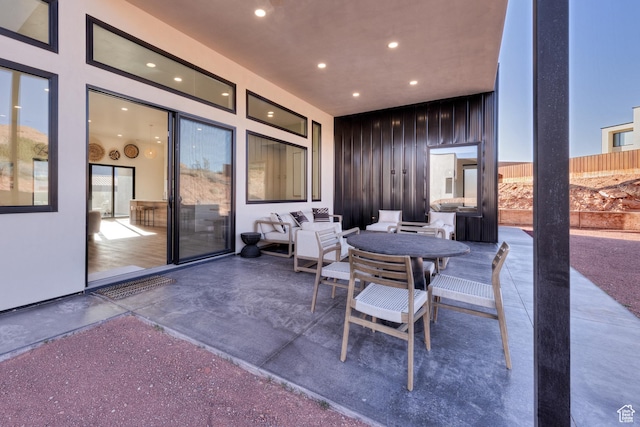 view of patio / terrace with outdoor dining space and fence