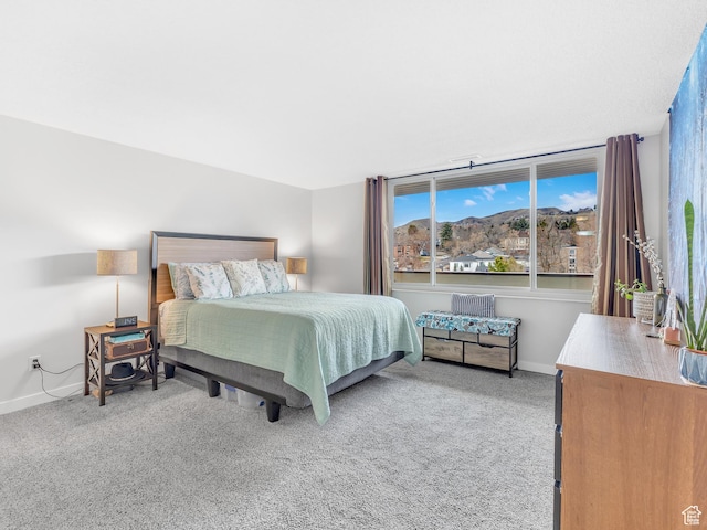 521 E 5th Ave Unit 605, Salt Lake City, UT 84103 - bedroom featuring carpet flooring, a mountain view, and baseboards