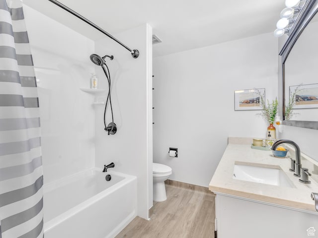 521 E 5th Ave Unit 605, Salt Lake City, UT 84103 - full bathroom featuring shower / bathtub combination with curtain, toilet, vanity, and wood finished floors