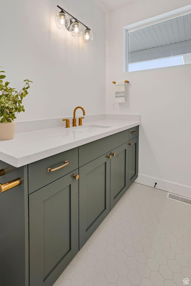 2878 W 2850 S, West Haven, UT 84401 - bathroom featuring tile patterned floors, visible vents, baseboards, and vanity