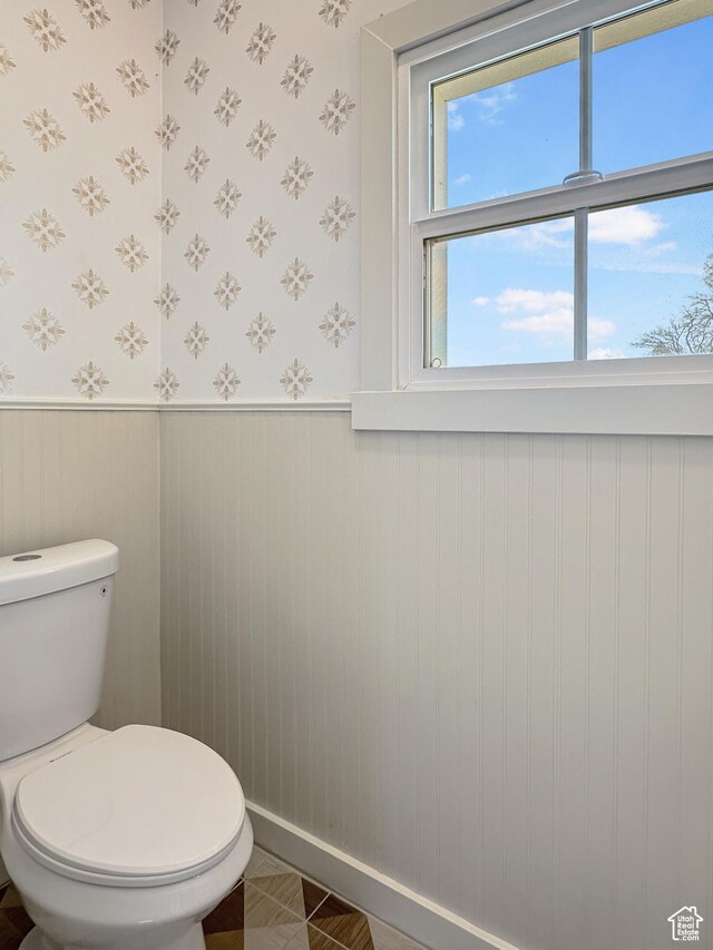 120 S 200 E, Castle Dale, UT 84513 - bathroom with wallpapered walls, toilet, and a wainscoted wall