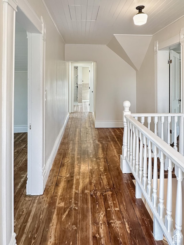 120 S 200 E, Castle Dale, UT 84513 - corridor with lofted ceiling, an upstairs landing, dark wood-style flooring, and baseboards