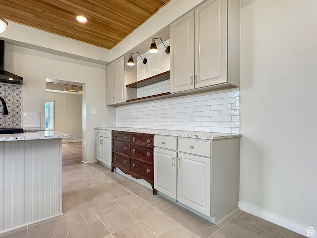 120 S 200 E, Castle Dale, UT 84513 - kitchen with backsplash, baseboards, light stone counters, wooden ceiling, and open shelves
