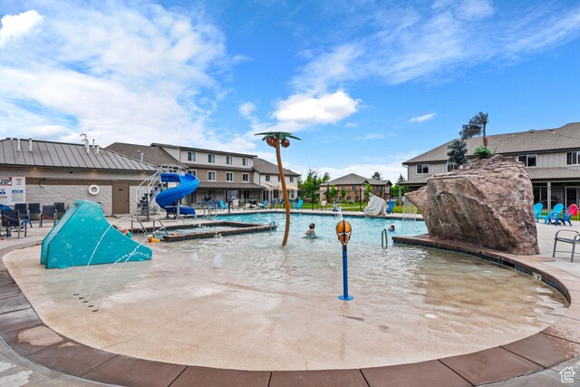 140 W 150th St S Unit D12, Garden City, UT 84028 - pool featuring a residential view, a water slide, and a patio