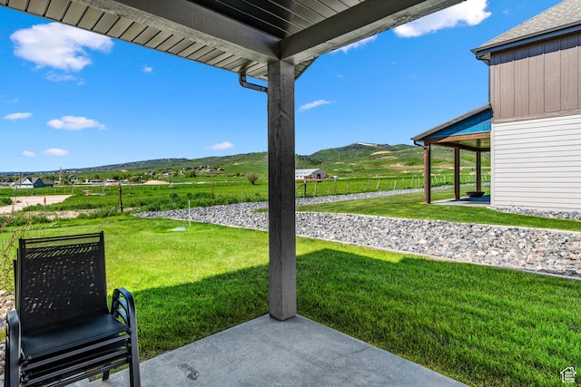 140 W 150th St S Unit D12, Garden City, UT 84028 - view of patio with a rural view and a mountain view