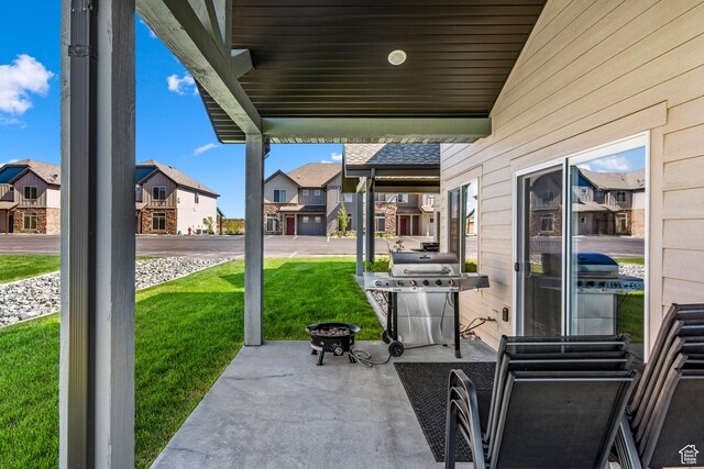 140 W 150th St S Unit D12, Garden City, UT 84028 - view of patio featuring a residential view and a grill
