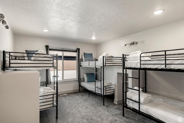 140 W 150th St S Unit D12, Garden City, UT 84028 - carpeted bedroom with baseboards and a textured ceiling