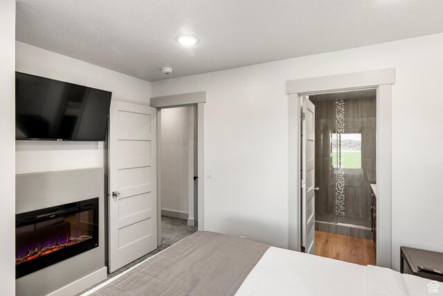 140 W 150th St S Unit D12, Garden City, UT 84028 - bedroom with ensuite bath and baseboards
