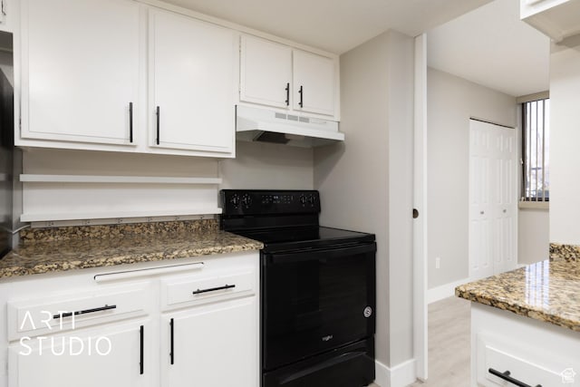 kitchen featuring under cabinet range hood, white cabinets, stone countertops, and black range with electric cooktop