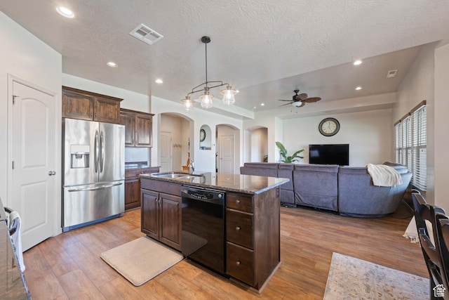 265 E Kimball Ct, Washington, UT 84780 - kitchen with visible vents, stainless steel refrigerator with ice dispenser, a sink, arched walkways, and dishwasher