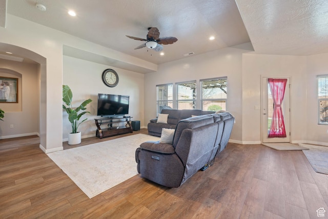 265 E Kimball Ct, Washington, UT 84780 - living area featuring wood finished floors, baseboards, arched walkways, ceiling fan, and a textured ceiling
