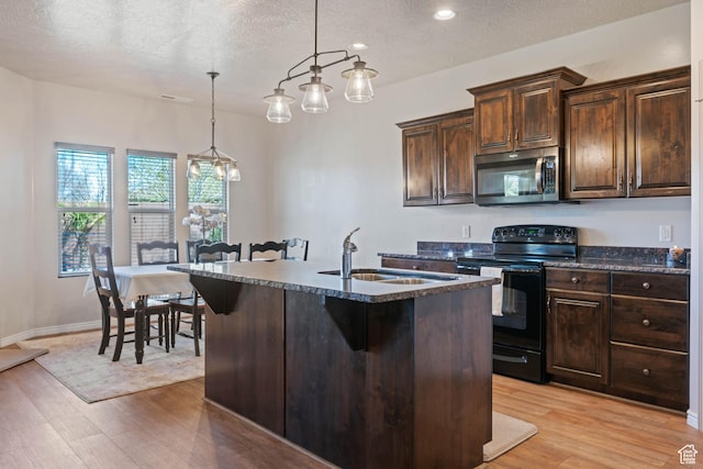 265 E Kimball Ct, Washington, UT 84780 - kitchen featuring stainless steel microwave, light wood-type flooring, black range with electric cooktop, and a sink