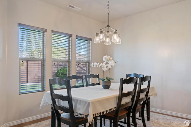 265 E Kimball Ct, Washington, UT 84780 - dining room with visible vents, an inviting chandelier, baseboards, and wood finished floors