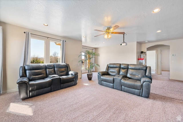 265 E Kimball Ct, Washington, UT 84780 - living room with arched walkways, recessed lighting, carpet, and ceiling fan