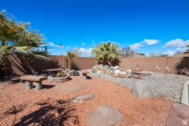 265 E Kimball Ct, Washington, UT 84780 - view of yard featuring a fire pit and a fenced backyard