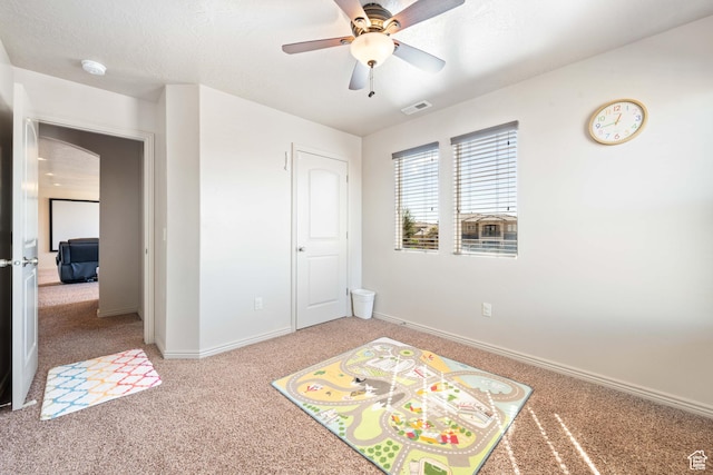 265 E Kimball Ct, Washington, UT 84780 - game room featuring a ceiling fan, baseboards, visible vents, a textured ceiling, and light colored carpet