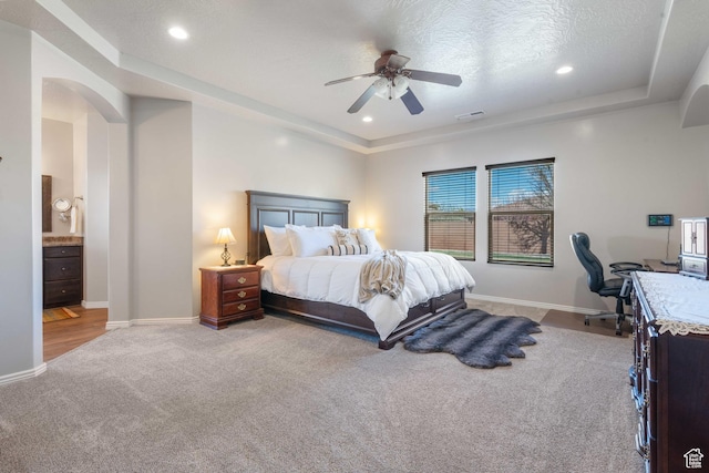 265 E Kimball Ct, Washington, UT 84780 - bedroom with a raised ceiling, baseboards, visible vents, and arched walkways