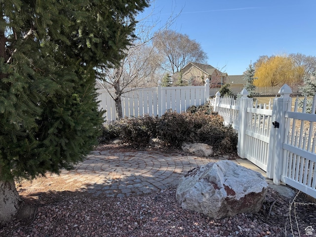 view of yard with a gate and fence