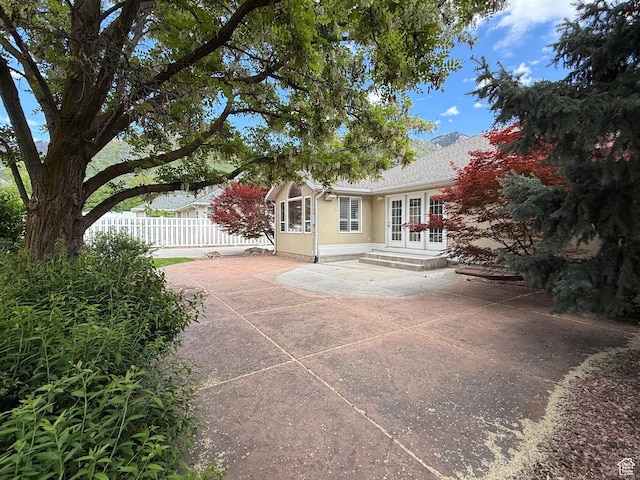 1164 E 2650 N, North Ogden, UT 84414 - back of house featuring french doors, a patio area, and stucco siding