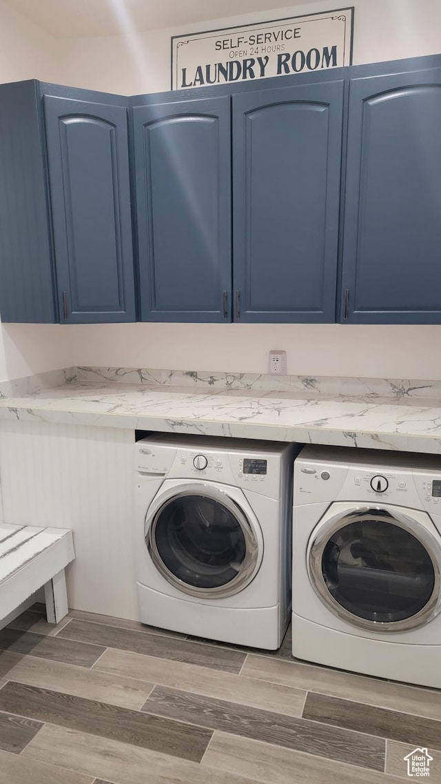 596 W 200 S, Vernal, UT 84078 - washroom featuring cabinet space, wood finished floors, and washer and clothes dryer