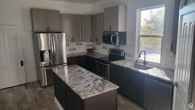 596 W 200 S, Vernal, UT 84078 - kitchen with decorative backsplash, appliances with stainless steel finishes, wood finished floors, and a sink
