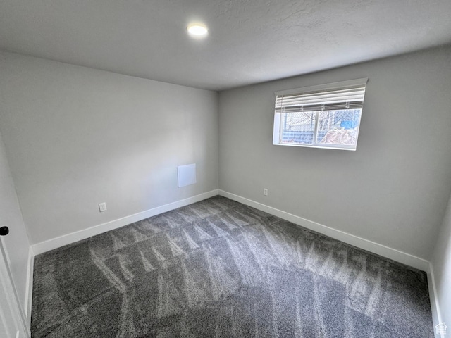 unfurnished room featuring baseboards and carpet floors