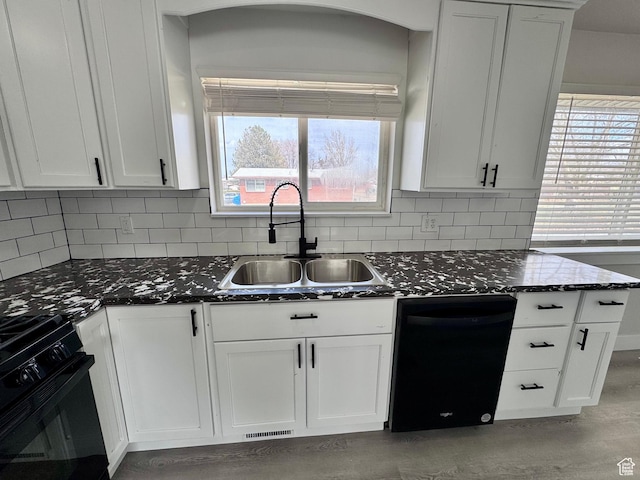 kitchen with white cabinetry, a healthy amount of sunlight, range with gas stovetop, a sink, and dishwasher