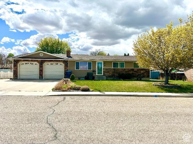 single story home featuring fence, a front yard, a chimney, an attached garage, and driveway