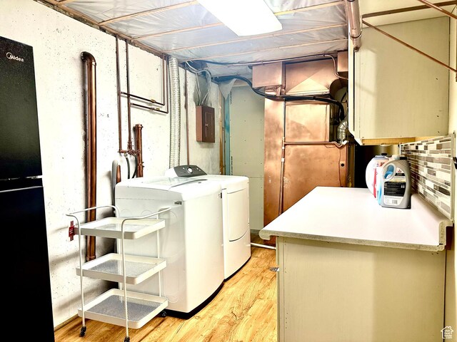 384 S 350 W, Vernal, UT 84078 - laundry area featuring independent washer and dryer, cabinet space, electric panel, and light wood-type flooring