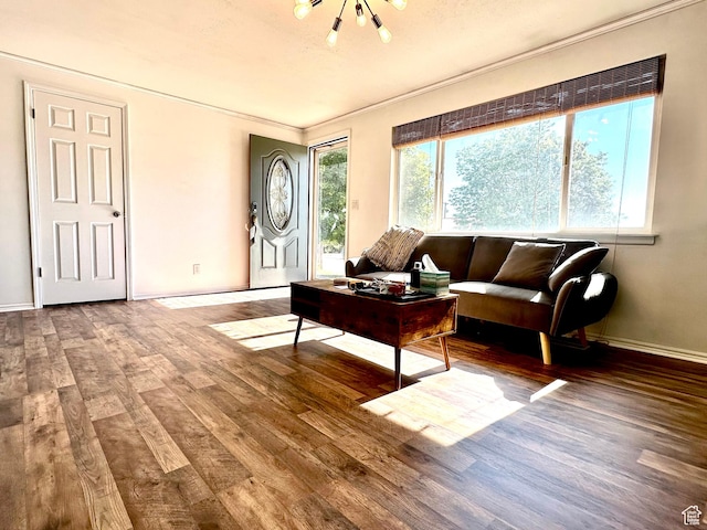 384 S 350 W, Vernal, UT 84078 - living room featuring wood finished floors, baseboards, crown molding, and a chandelier