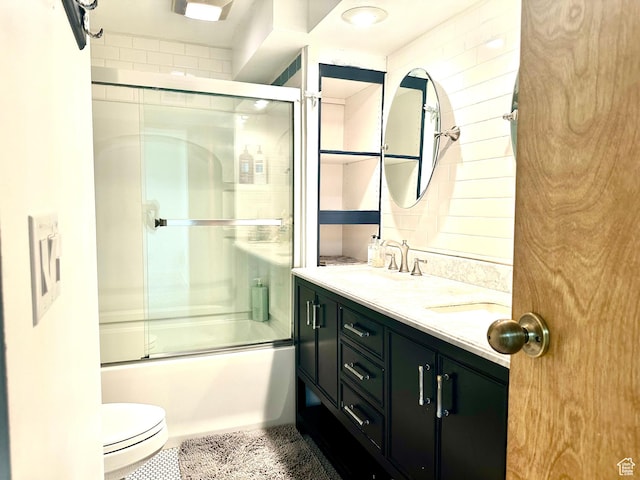 384 S 350 W, Vernal, UT 84078 - bathroom with double vanity, bath / shower combo with glass door, and toilet
