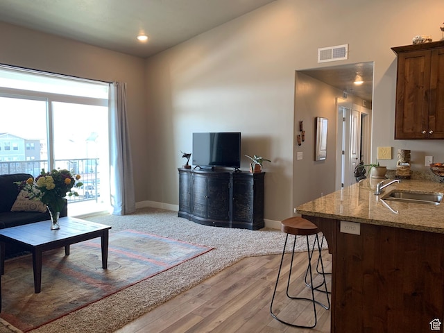 1128 S 820 E Unit 7304, Heber City, UT 84032 - living area with lofted ceiling, baseboards, visible vents, and light wood finished floors