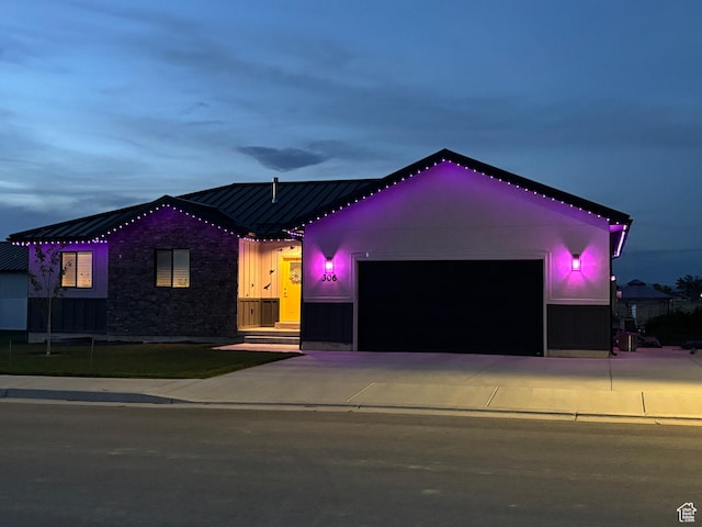 306 W 450 S, Ephraim, UT 84627 - view of front of home with a standing seam roof, an attached garage, a metal roof, concrete driveway, and stone siding