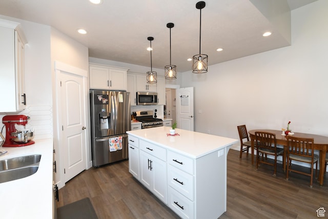 306 W 450 S, Ephraim, UT 84627 - kitchen with stainless steel appliances, white cabinets, decorative backsplash, dark wood-style floors, and recessed lighting