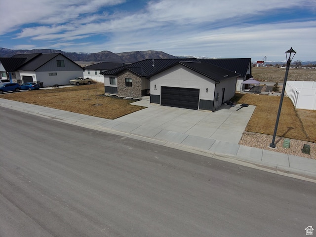 306 W 450 S, Ephraim, UT 84627 - view of front of property featuring an attached garage, a metal roof, a mountain view, and a standing seam roof