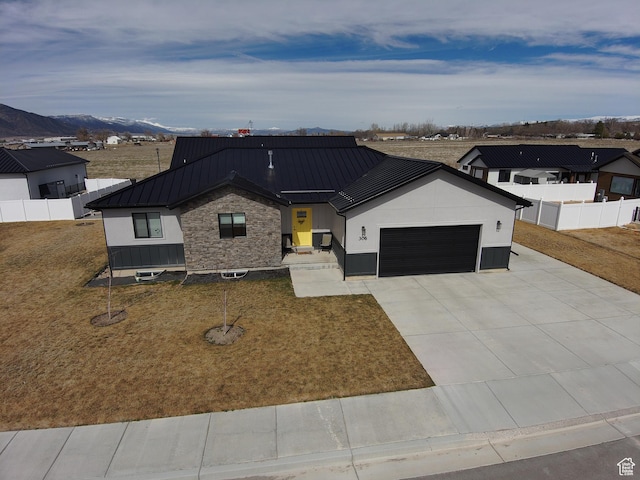 306 W 450 S, Ephraim, UT 84627 - modern farmhouse with an attached garage, concrete driveway, a metal roof, a standing seam roof, and a mountain view