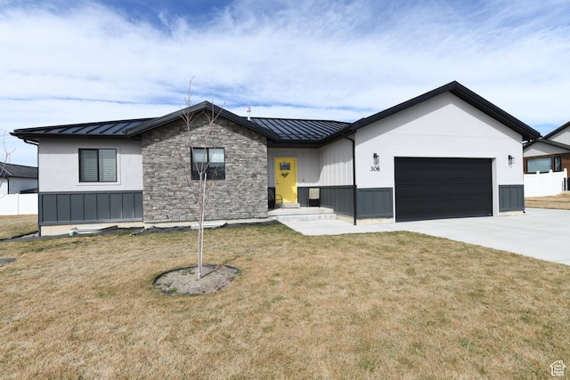 modern inspired farmhouse featuring a front yard, metal roof, a garage, driveway, and a standing seam roof