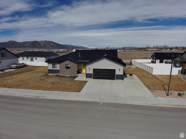 306 W 450 S, Ephraim, UT 84627 - modern farmhouse with a mountain view, an attached garage, a metal roof, driveway, and a standing seam roof