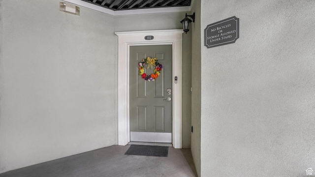 doorway to property with stucco siding